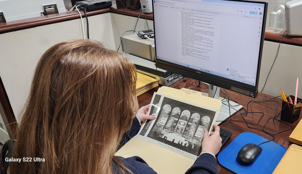 Intern working with a photograph collection