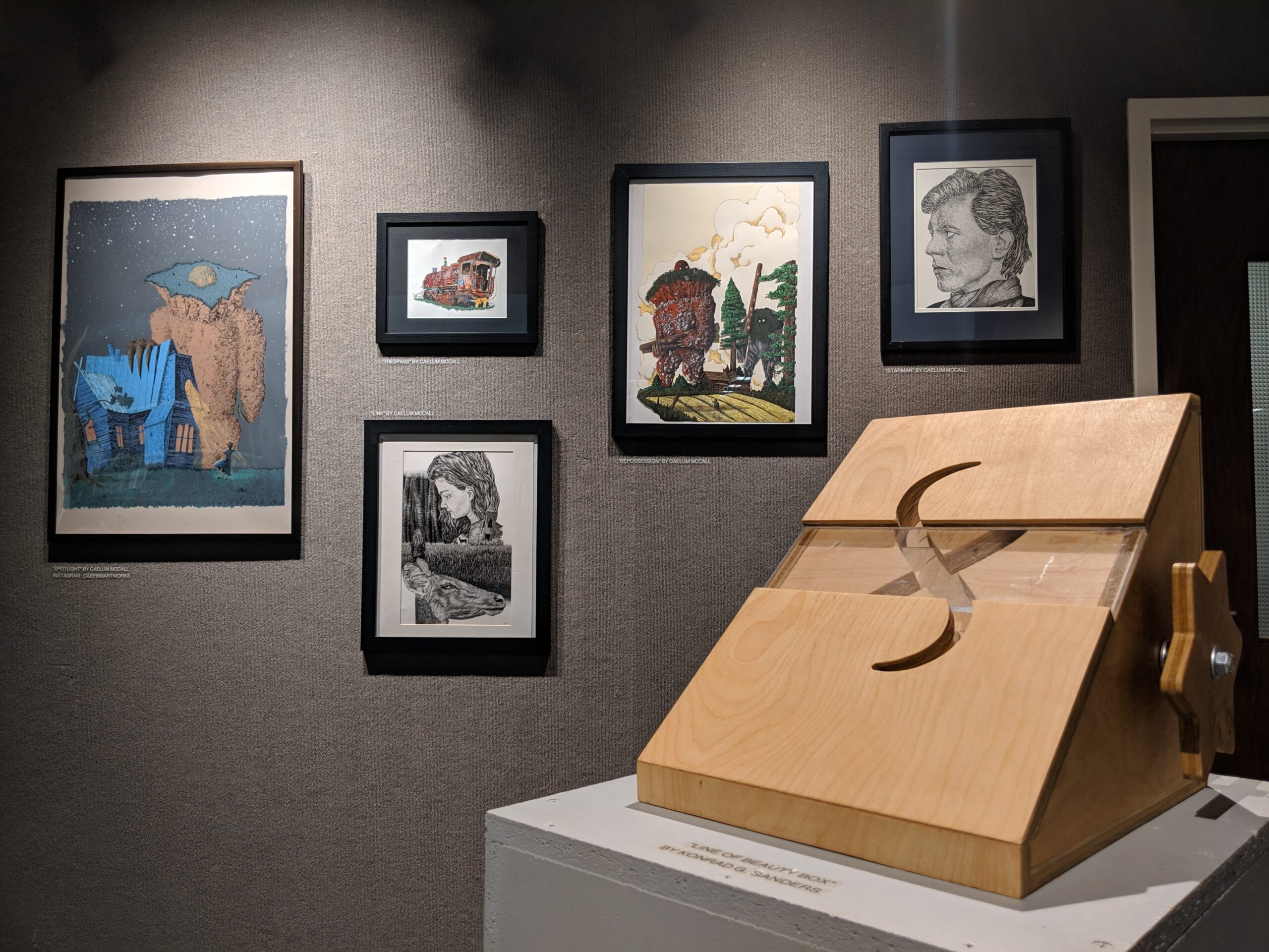 Konrad G. Sanders and Caelum McCall's pieces in UNCA Student Art Exhibition